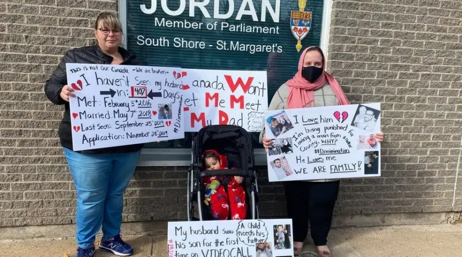 Woman Protests Husband’s Visa Refusal