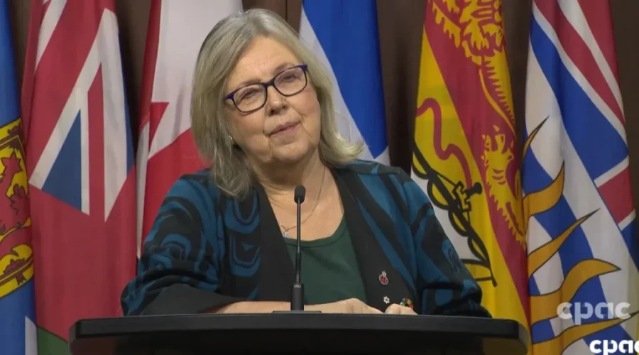 May encourages united front in dealing with Trump